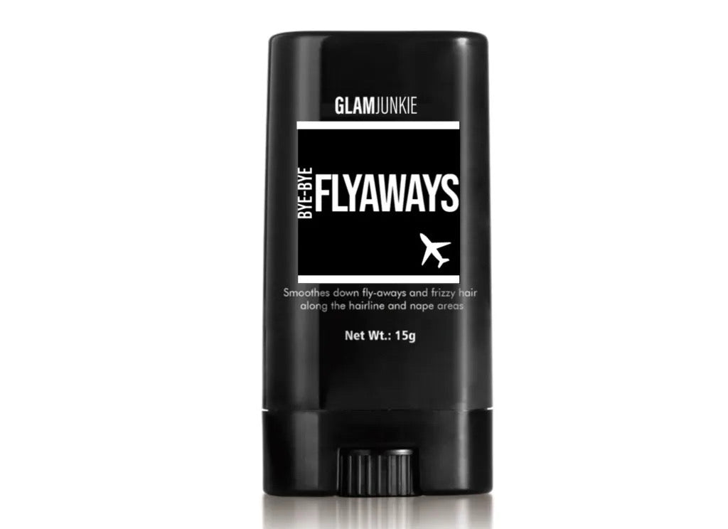 A black, 1.5g gel stick in stylish packaging labeled 'GLAMJUNKIE BYE-BYE FLYAWAYS', designed for hairstyling purposes. Smooths down fly-aways and frizzy hair along the hairline and nape areas. 